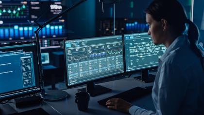A data scientist uses artificial intelligence to analyze incoming data in real time.